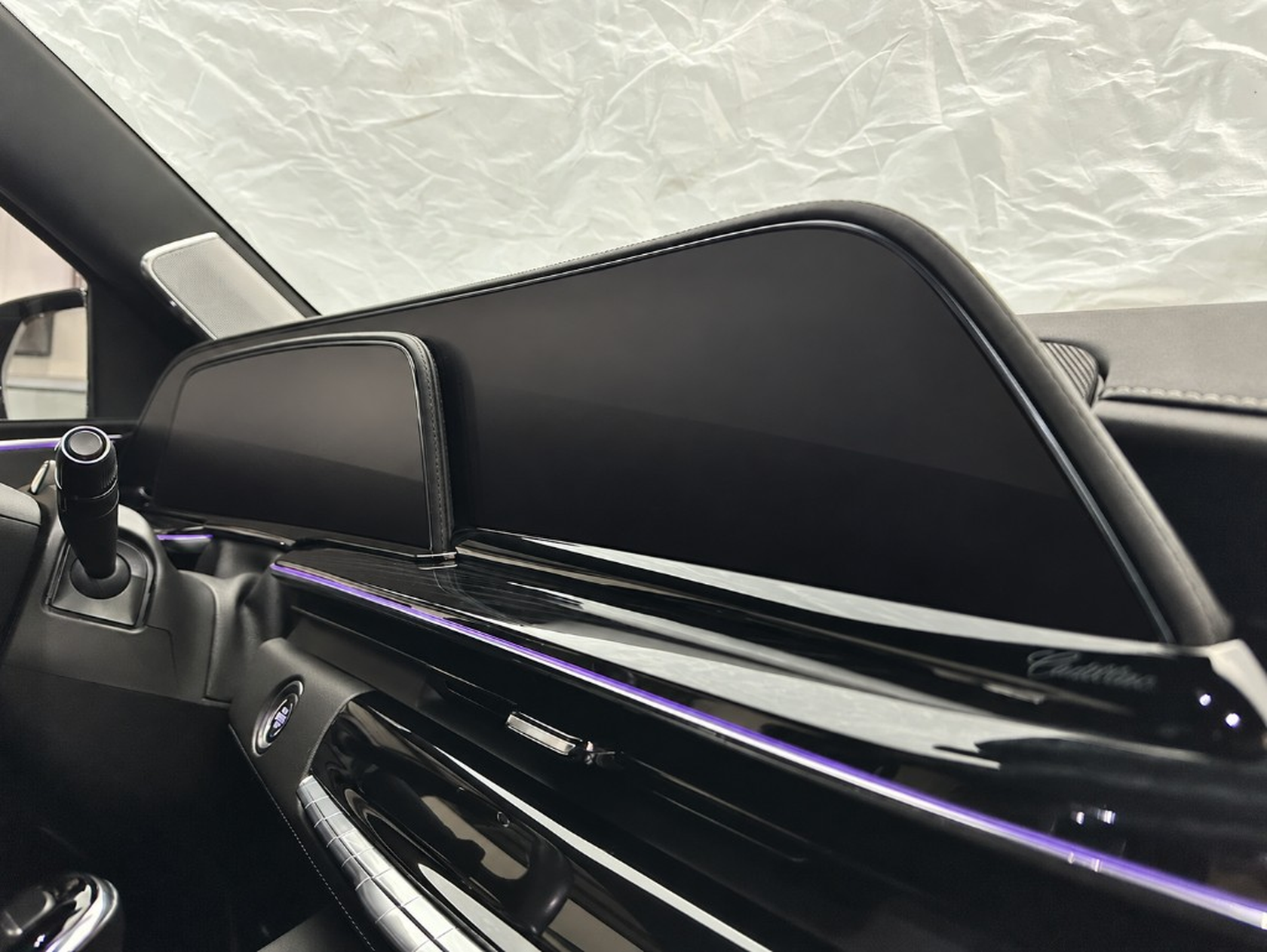 The same Cadillac dashboard and screen after a wipe-down with Ne10 Interior Detailer